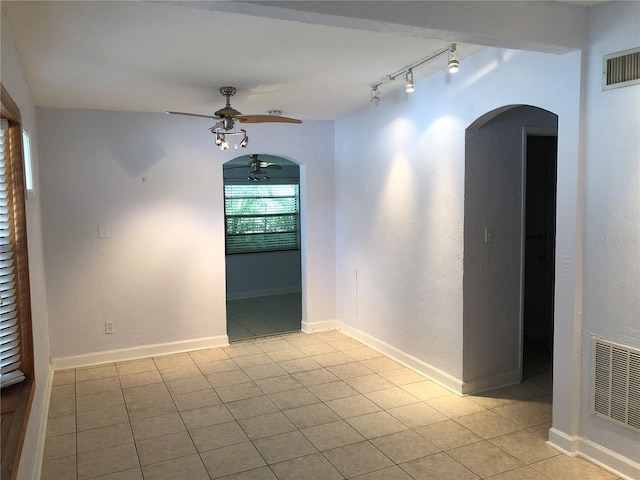 122 19th Ave N, Saint Petersburg, FL 33704 - spare room featuring ceiling fan, visible vents, light tile patterned floors, and rail lighting
