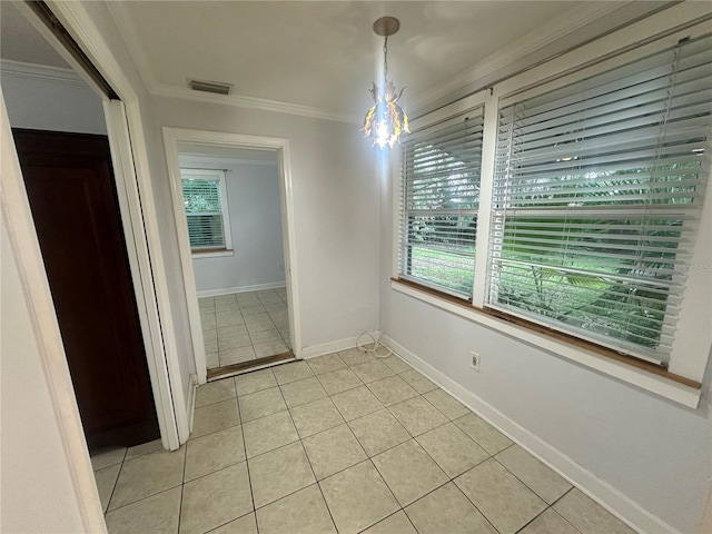 122 19th Ave N, Saint Petersburg, FL 33704 - unfurnished dining area featuring crown molding, plenty of natural light, an inviting chandelier, and visible vents