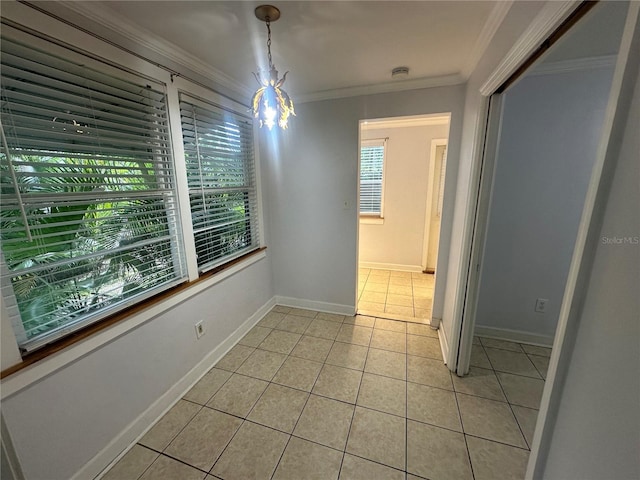 122 19th Ave N, Saint Petersburg, FL 33704 - unfurnished dining area with crown molding, light tile patterned flooring, and baseboards