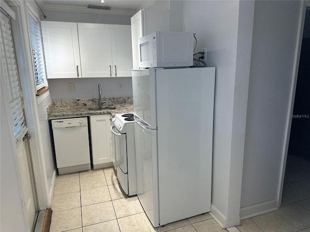 122 19th Ave N, Saint Petersburg, FL 33704 - kitchen with white appliances, light tile patterned flooring, and a sink