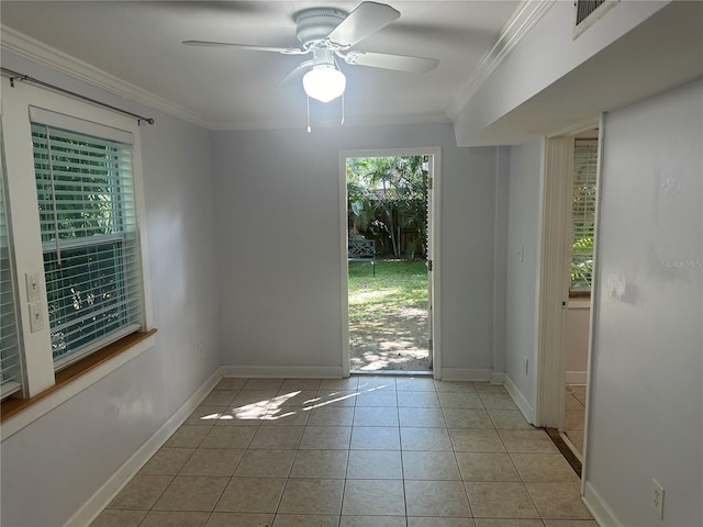 122 19th Ave N, Saint Petersburg, FL 33704 - tiled empty room with visible vents, ornamental molding, baseboards, and a ceiling fan
