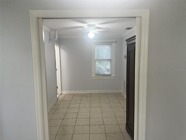 122 19th Ave N, Saint Petersburg, FL 33704 - corridor with crown molding, baseboards, light tile patterned flooring, and visible vents