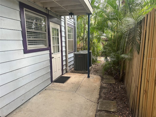 122 19th Ave N, Saint Petersburg, FL 33704 - view of property exterior featuring central AC unit and fence