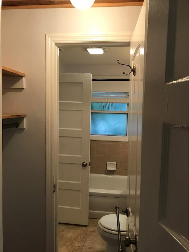 122 19th Ave N, Saint Petersburg, FL 33704 - full bath with toilet,  shower combination, and tile patterned flooring