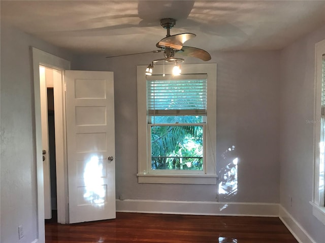 122 19th Ave N, Saint Petersburg, FL 33704 - unfurnished dining area featuring a ceiling fan, baseboards, and dark wood finished floors
