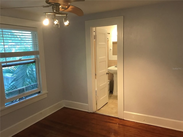 122 19th Ave N, Saint Petersburg, FL 33704 - spare room featuring baseboards, a ceiling fan, and wood finished floors