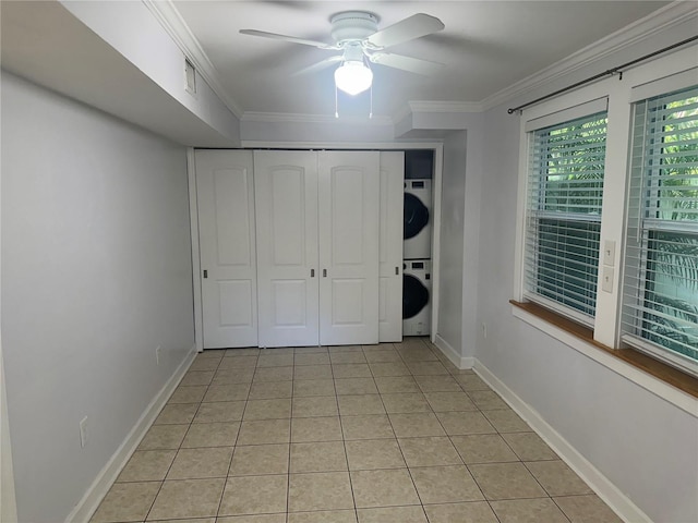 122 19th Ave N, Saint Petersburg, FL 33704 - unfurnished bedroom featuring visible vents, stacked washer and dryer, crown molding, baseboards, and light tile patterned floors