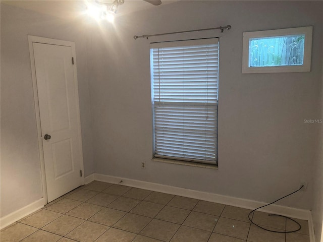122 19th Ave N, Saint Petersburg, FL 33704 - empty room featuring a ceiling fan, baseboards, and light tile patterned floors