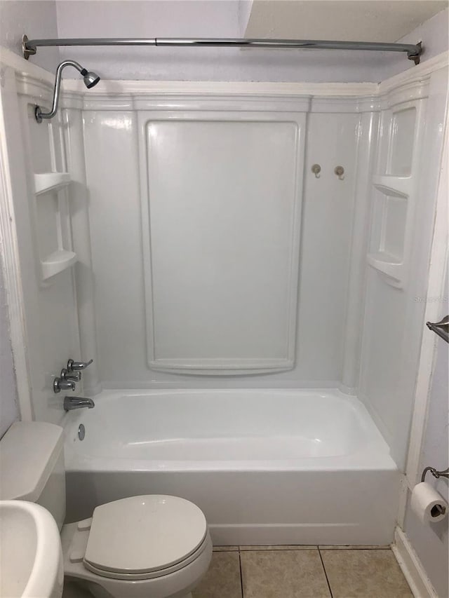 122 19th Ave N, Saint Petersburg, FL 33704 - bathroom featuring shower / tub combination, tile patterned floors, and toilet