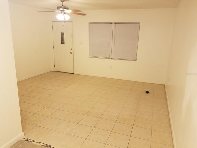 2210 Irene St, Lutz, FL 33549 - spare room featuring a ceiling fan, light tile patterned flooring, and baseboards