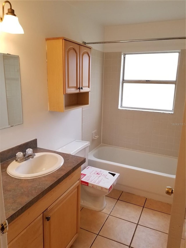 2210 Irene St, Lutz, FL 33549 - full bath featuring vanity, toilet, washtub / shower combination, and tile patterned flooring