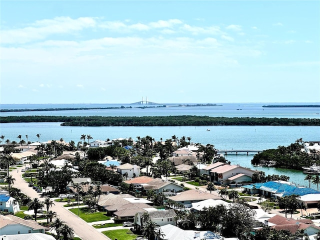 bird's eye view featuring a water view and a residential view