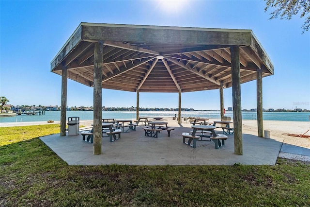 surrounding community featuring a water view, a gazebo, and a yard