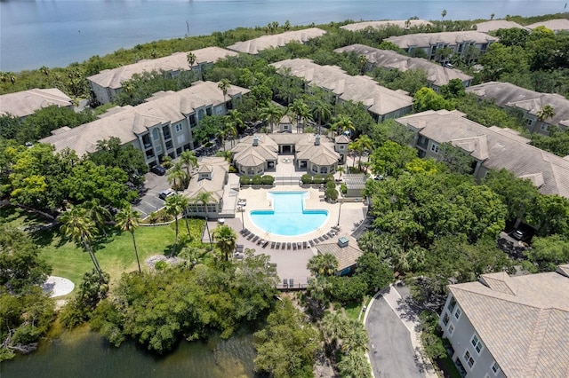 birds eye view of property featuring a water view and a residential view