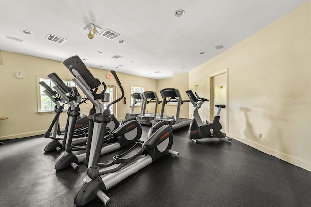 gym with baseboards and visible vents