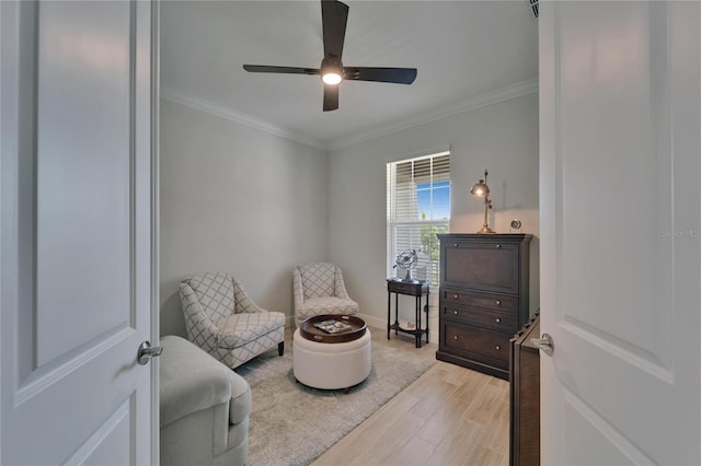 5828 Clairwood Ct, Palmetto, FL 34221 - sitting room featuring light wood-style floors, ornamental molding, a ceiling fan, and baseboards