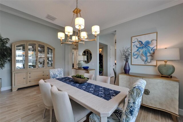 5828 Clairwood Ct, Palmetto, FL 34221 - dining room with a chandelier, wood finish floors, and baseboards