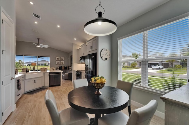 5828 Clairwood Ct, Palmetto, FL 34221 - dining space with vaulted ceiling, light wood-type flooring, a ceiling fan, recessed lighting, and baseboards