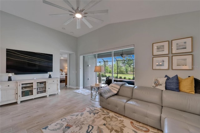 5828 Clairwood Ct, Palmetto, FL 34221 - living room with ceiling fan, light wood finished floors, baseboards, and high vaulted ceiling