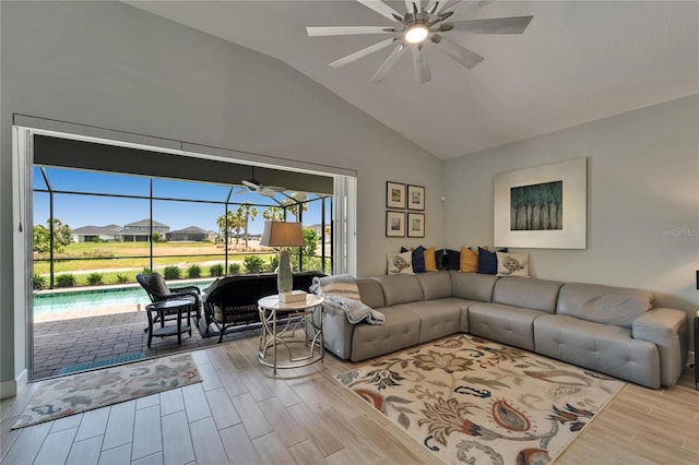 5828 Clairwood Ct, Palmetto, FL 34221 - living room featuring ceiling fan, wood finished floors, vaulted ceiling, and a sunroom