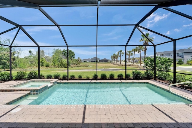 5828 Clairwood Ct, Palmetto, FL 34221 - view of pool with a pool with connected hot tub, a lanai, a patio, and a residential view