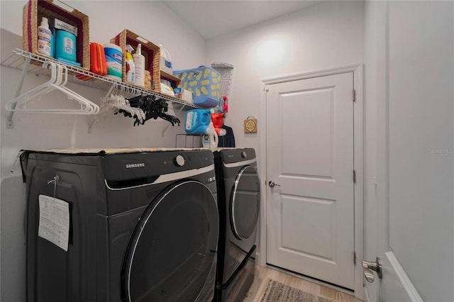 5828 Clairwood Ct, Palmetto, FL 34221 - laundry room featuring independent washer and dryer and light wood-style flooring