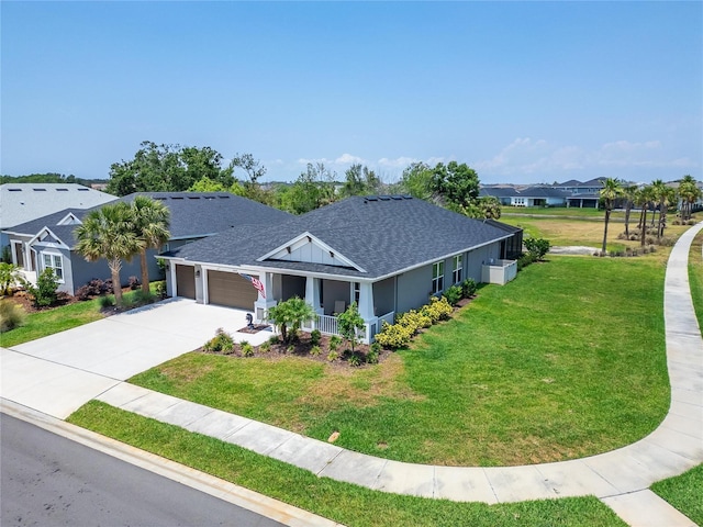 5828 Clairwood Ct, Palmetto, FL 34221 - ranch-style home featuring a shingled roof, a front yard, an attached garage, and driveway