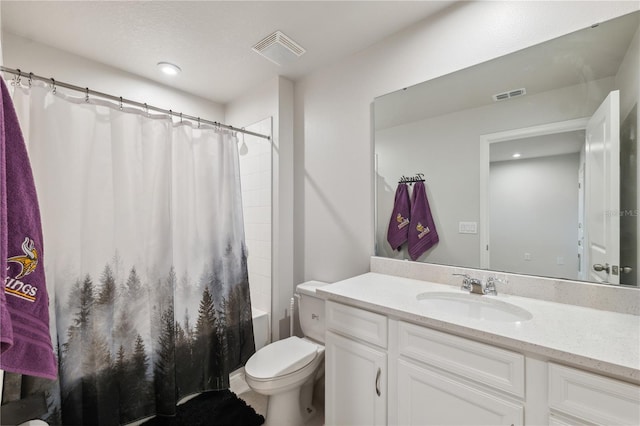 full bathroom with vanity, toilet, shower / bath combo with shower curtain, and visible vents