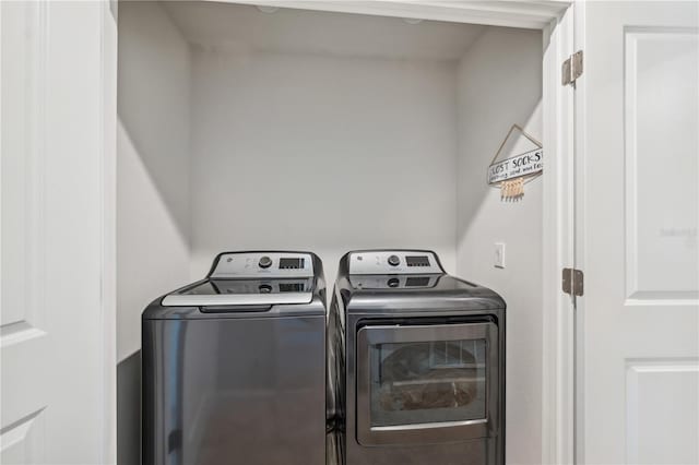 laundry area with washer and dryer and laundry area