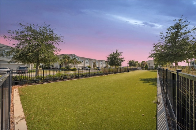 view of yard with a residential view and fence