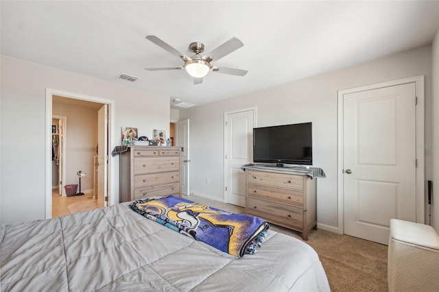 carpeted bedroom featuring visible vents, baseboards, and a ceiling fan
