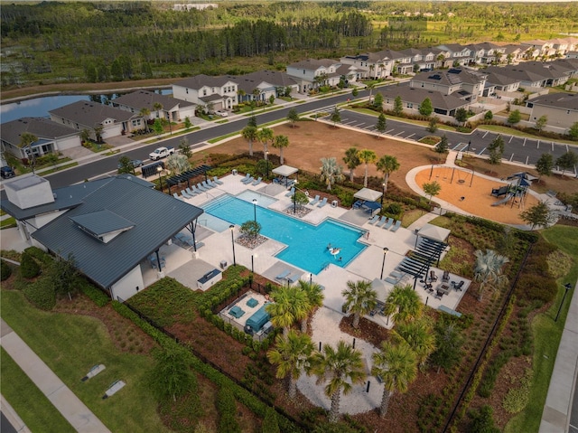 birds eye view of property with a residential view