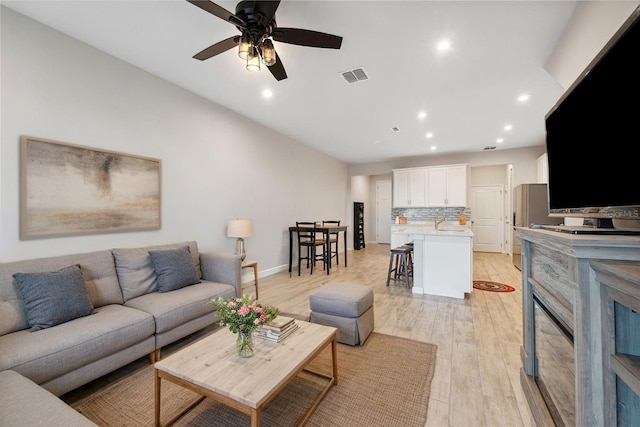 2529 Arbor Wind Dr, Lutz, FL 33558 - living room with a ceiling fan, light wood finished floors, recessed lighting, and baseboards