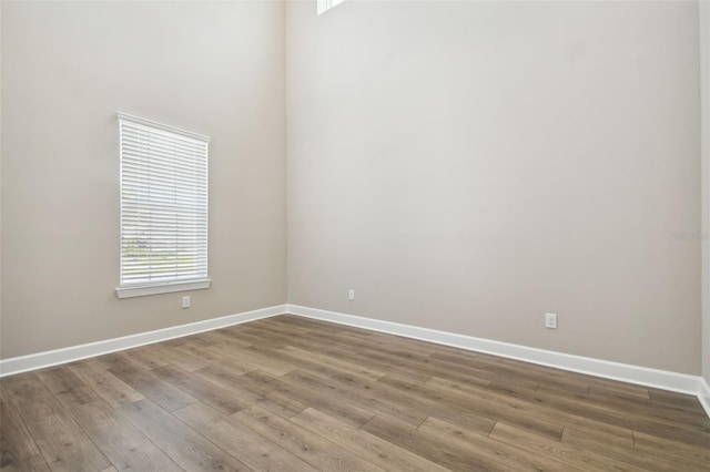 34084 Torrent Ln, Wesley Chapel, FL 33543 - empty room with wood finished floors and baseboards