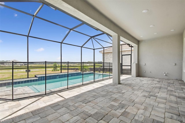 34084 Torrent Ln, Wesley Chapel, FL 33543 - outdoor pool featuring a patio area and glass enclosure