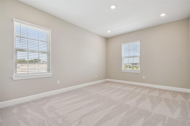 34084 Torrent Ln, Wesley Chapel, FL 33543 - unfurnished room with light colored carpet, baseboards, and recessed lighting