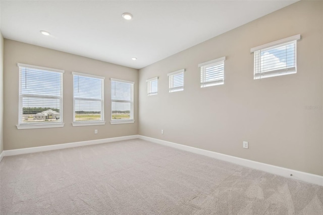 34084 Torrent Ln, Wesley Chapel, FL 33543 - empty room with light carpet, baseboards, and recessed lighting