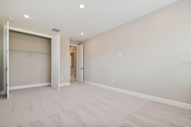 34084 Torrent Ln, Wesley Chapel, FL 33543 - unfurnished bedroom with baseboards, a closet, recessed lighting, and light carpet
