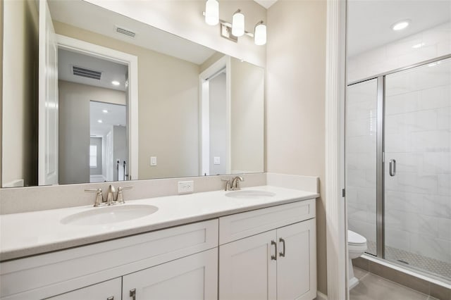 34084 Torrent Ln, Wesley Chapel, FL 33543 - bathroom featuring a shower stall, toilet, and double vanity