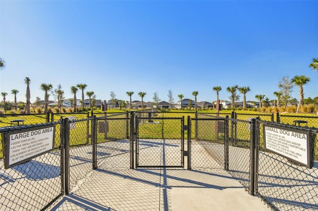 34084 Torrent Ln, Wesley Chapel, FL 33543 - view of patio with a gate and a residential view