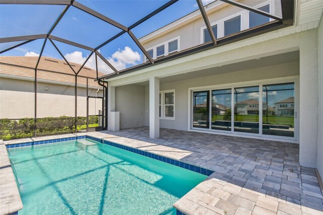 34084 Torrent Ln, Wesley Chapel, FL 33543 - swimming pool with a patio and glass enclosure