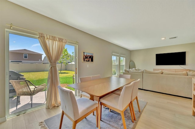 dining room with recessed lighting, visible vents, plenty of natural light, and light wood-style flooring