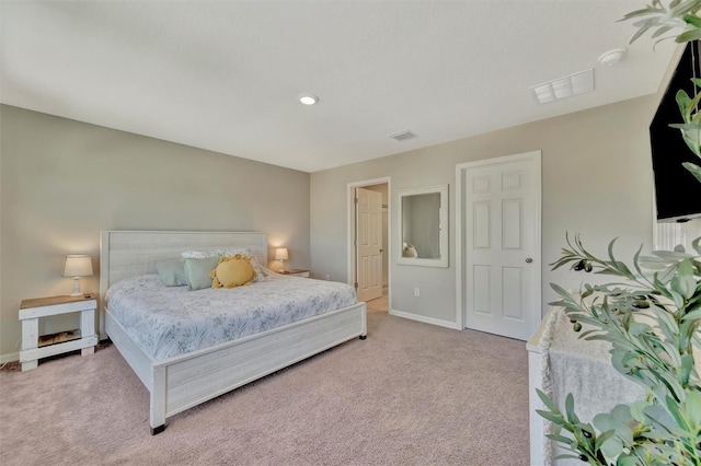 bedroom featuring visible vents, recessed lighting, baseboards, and light colored carpet