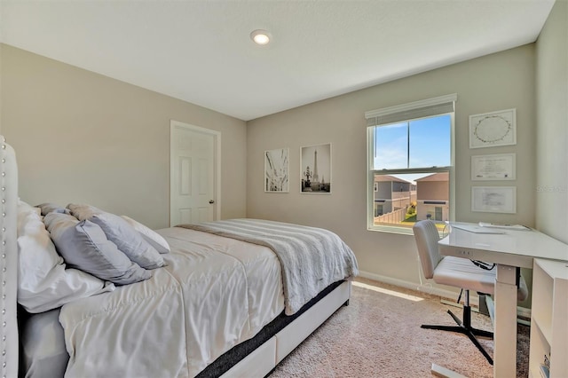 carpeted bedroom with baseboards