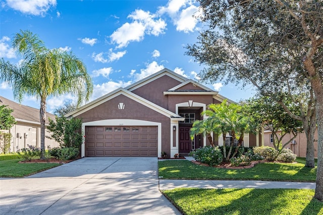 13653 Artesa Bell Dr, Riverview, FL 33579 - single story home featuring stucco siding, a garage, concrete driveway, and a front lawn