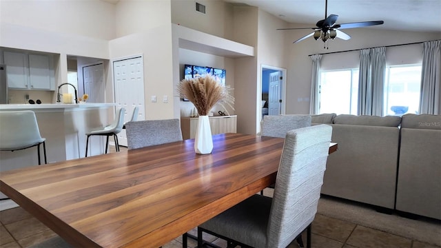13653 Artesa Bell Dr, Riverview, FL 33579 - tiled dining area with ceiling fan, lofted ceiling, and a sink