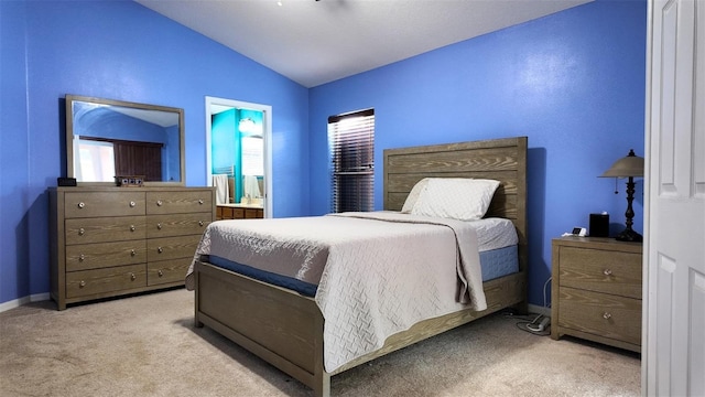 13653 Artesa Bell Dr, Riverview, FL 33579 - bedroom with vaulted ceiling, carpet floors, baseboards, and ensuite bathroom