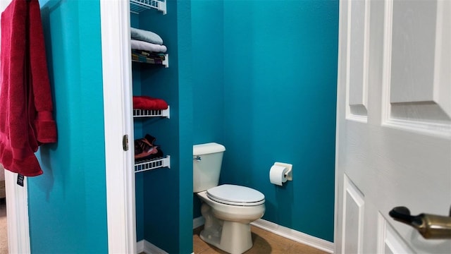 13653 Artesa Bell Dr, Riverview, FL 33579 - bathroom with toilet, tile patterned flooring, and baseboards