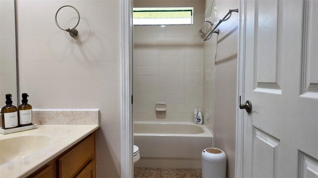 13653 Artesa Bell Dr, Riverview, FL 33579 - bathroom with toilet, vanity, tile patterned floors, and bathtub / shower combination