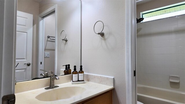13653 Artesa Bell Dr, Riverview, FL 33579 - full bath with vanity, a textured wall, and bathtub / shower combination